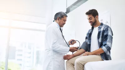  Healthcare, patient and doctor with blood pressure test, health and wellness checkup of person at hospital.
