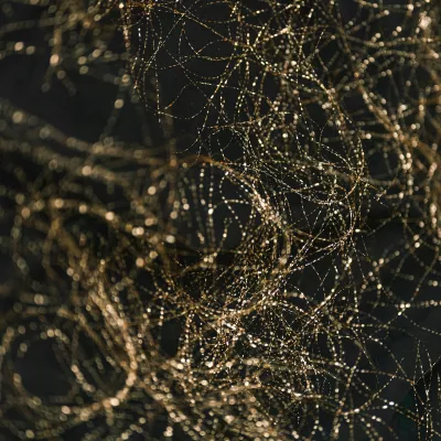 Close-up of a cell phone with a bunch of wires on it (decorative)